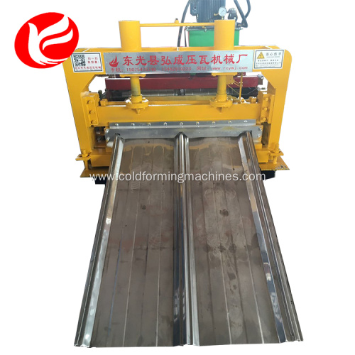 Joint-hidden roof and wall panel roll forming machine